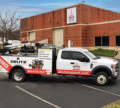 Deutz service truck parked outside a building