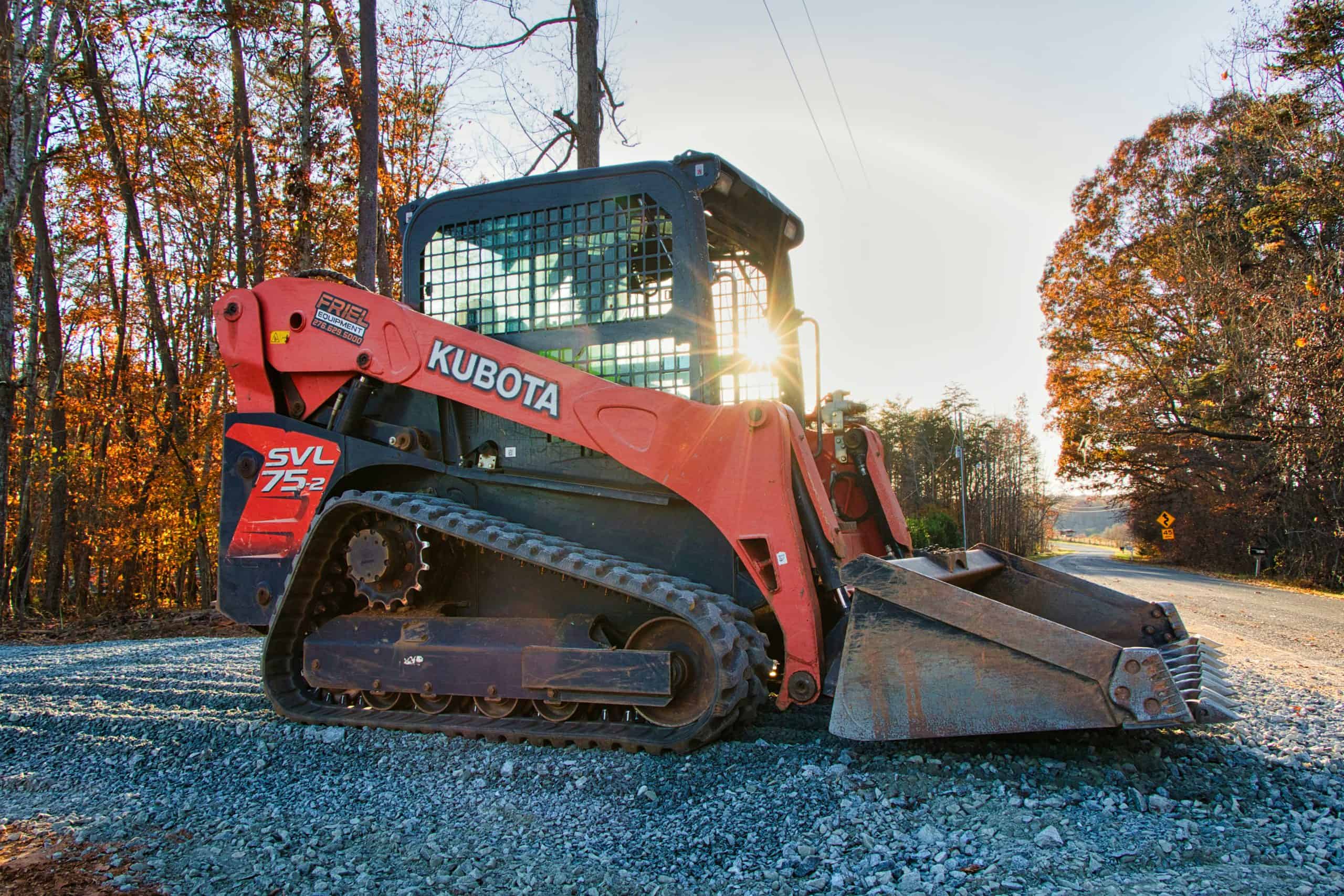 Kubota compact track loader on gravel road