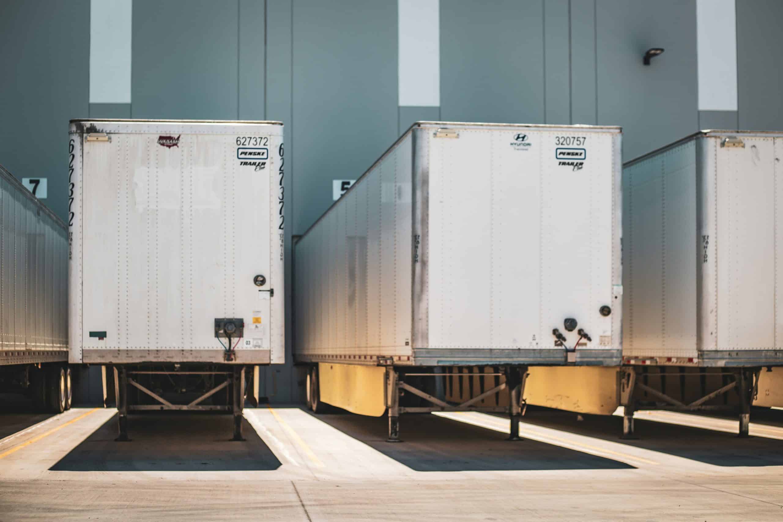 Semi-truck trailers at warehouse loading docks
